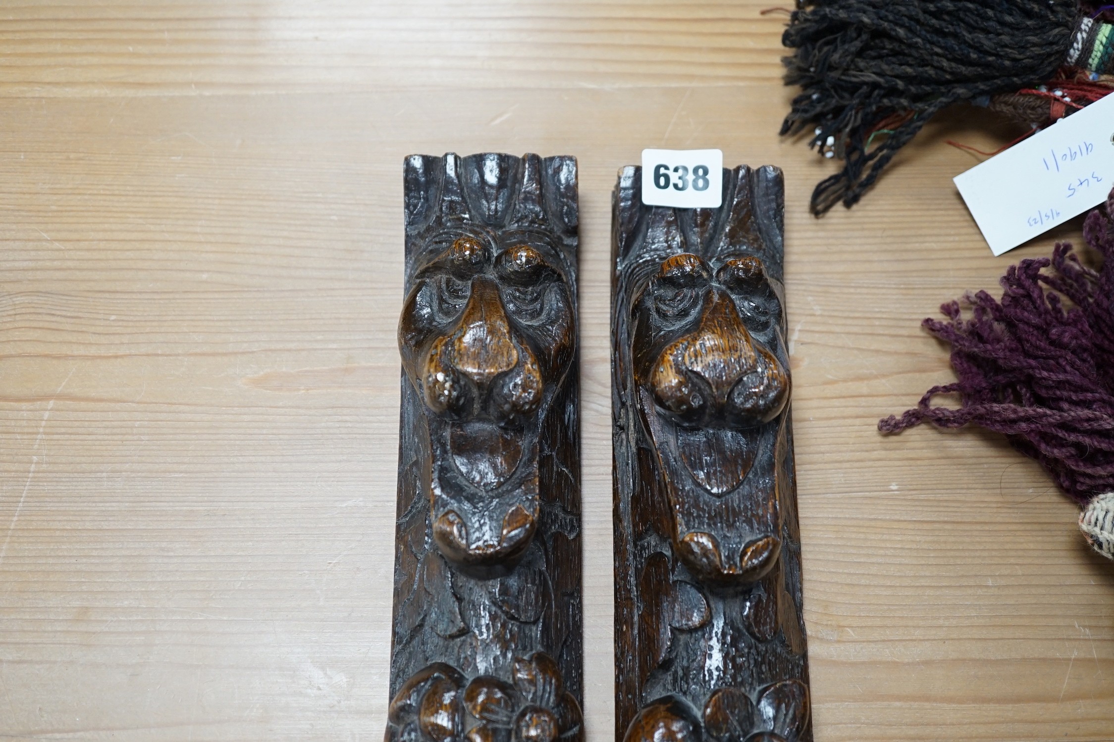 A pair of early carved wood hanging mouldings in the Flemish style, 81cm tall